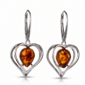 Pair of “Hearts” Baltic Honey Amber Drop Earrings in Sterling Silver on a white background.