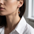Close-up of a model wearing an “Autumn” Baltic Honey Amber Drop Earring.