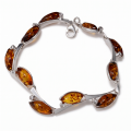 “Blossom” Baltic Honey Amber Bracelet in Sterling Silver on a white background.