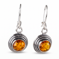 Pair of Baltic Honey Amber Round Drop Earrings in Sterling Silver on a white background.