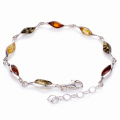 “Alexa” Multicolor Baltic Amber Bracelet in Sterling Silver on a white background.