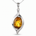 “Freya” Baltic Honey Amber Pendant in Sterling Silver on a white background.
