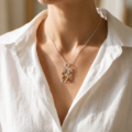 Close-up of a model wearing a Multicolor Baltic Amber Rectangle Pendant in Sterling Silver.