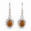 Pair of “Linda” Baltic Honey Amber Earrings in Sterling Silver on a white background.