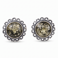 Pair of “Anika” Baltic Green Amber Stud Earrings in Sterling Silver on a white background.