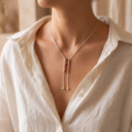 Baltic Honey Amber Necklace in Sterling Silver worn by a model, shown in a close-up view of the neck and collarbone.