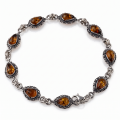 “Bajena” Baltic Honey Amber Bracelet in Sterling Silver displayed on a white background.
