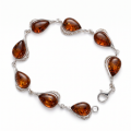 “Adele” Baltic Honey Amber Bracelet in Sterling Silver displayed on a white background.