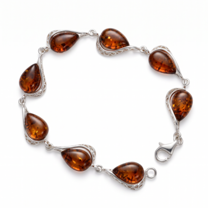 “Adele” Baltic Honey Amber Bracelet in Sterling Silver displayed on a white background.