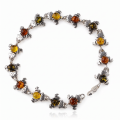 “Frogs” Multicolor Baltic Amber Bracelet in Sterling Silver displayed on a white background.