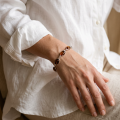 Baltic Honey Amber Bracelet in Sterling Silver worn on a model’s wrist, shown in a close-up view.