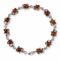 “Cats” Baltic Honey Amber Bracelet in Sterling Silver displayed on a white background.