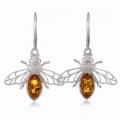 Pair of GIA Certified Bumble Bee Baltic Honey Amber Drop Earrings in Sterling Silver displayed on a white background.