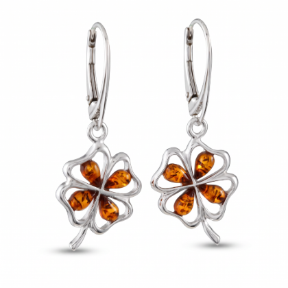 “Shamrock” Baltic Honey Amber Drop Earrings in Sterling Silver worn by a model, shown in a close-up view of the ear.