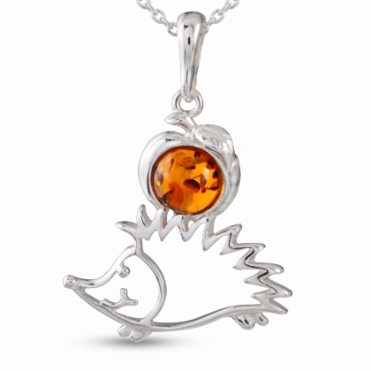 Baltic Honey Amber Hedgehog Pendant in Sterling Silver worn on a chain, shown in a close-up view of the neck and collarbone.