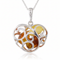 Baltic Amber Heart Pendant in Sterling Silver worn on a chain, shown in a close-up view of the neck and collarbone.